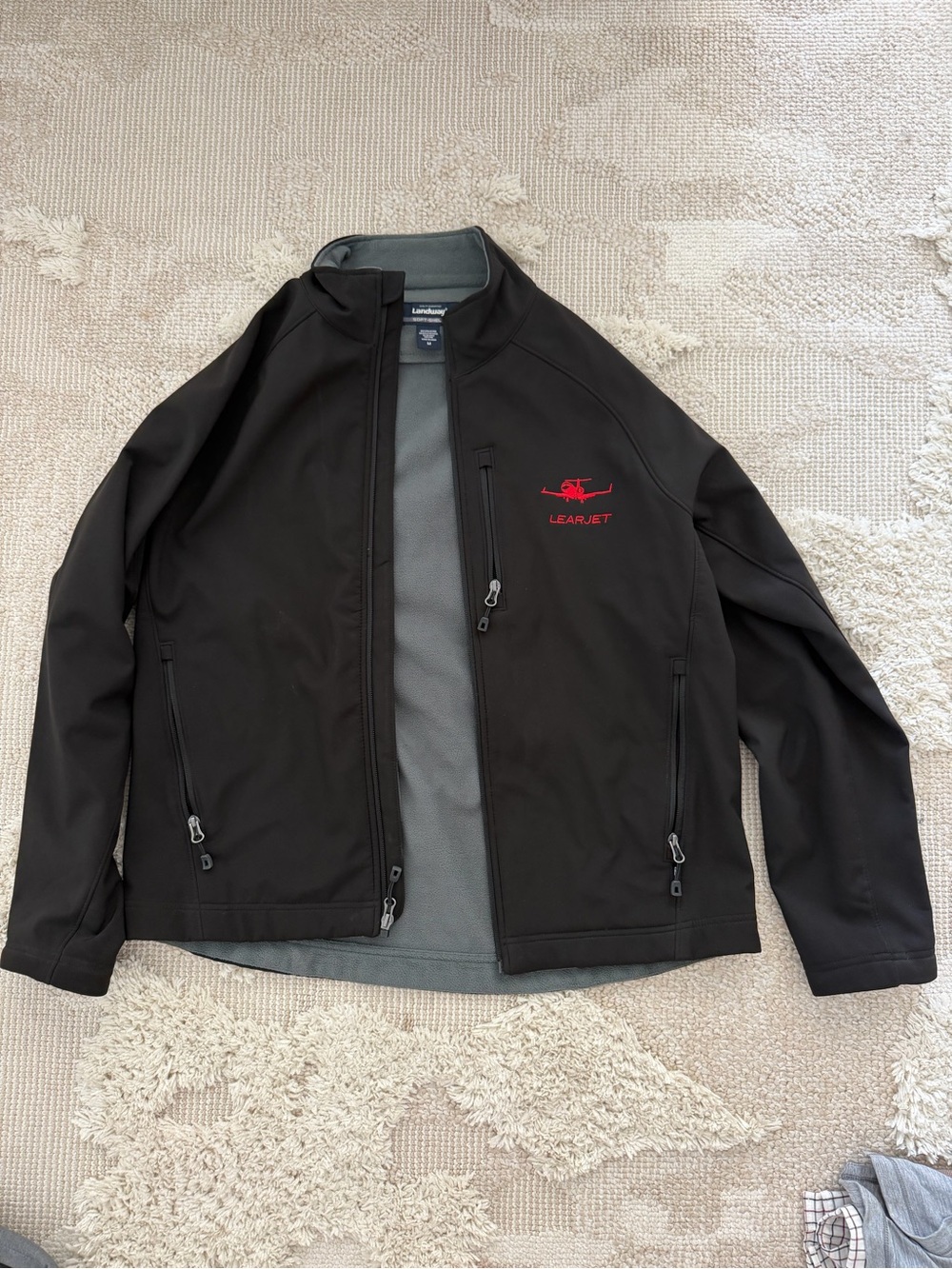 Landway Men's Black Softshell Jacket with Red Learjet Logo